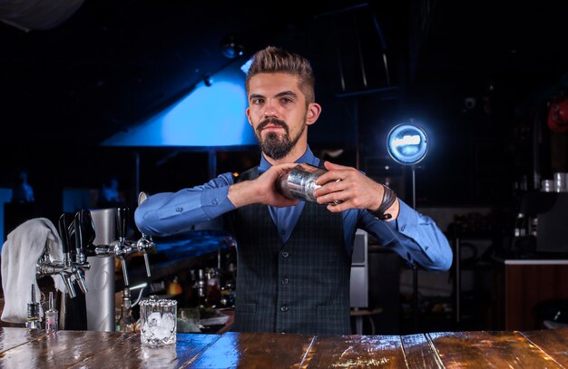 Barman mixes a cocktail at the beerhouse