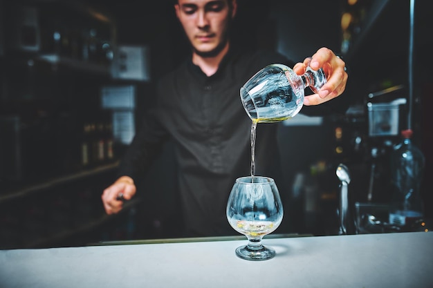 Barman at work, preparing cocktails.  concept about service and beverages.