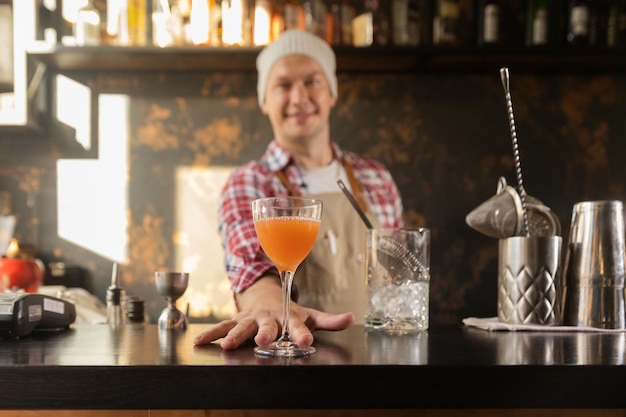 Barman at work preparing cocktails concept about service and beverages