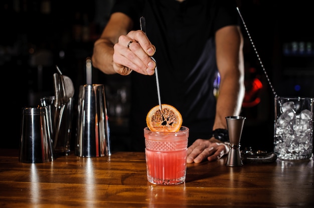 Barman at work, preparing cocktails