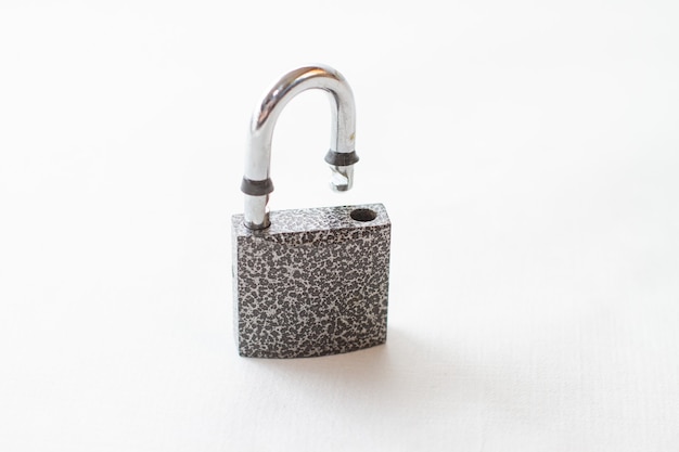 A barn door metal lock on a white background