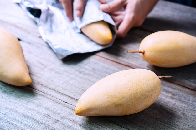 Barracuda mangoes on wooden table