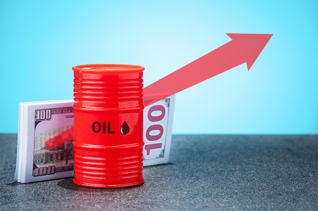 Barrel of oil dollar banknotes and red up arrow Growth in the oil market Oil products price growth