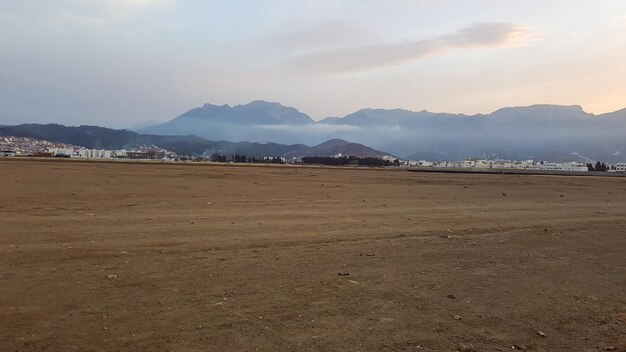 Barren wasteland exploring a large area of soil devoid of grass