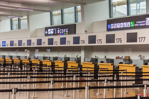 Barriers and information signs to the different check in on the airport