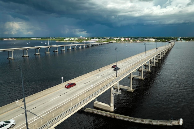 Barron Collier Bridge and Gilchrist Bridge in Florida with moving traffic Transportation infrastructure in Charlotte County connecting Punta Gorda and Port Charlotte over Peace River