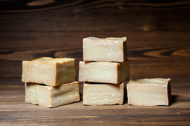 Bars of traditional aleppo natural laurel soap on a wooden background