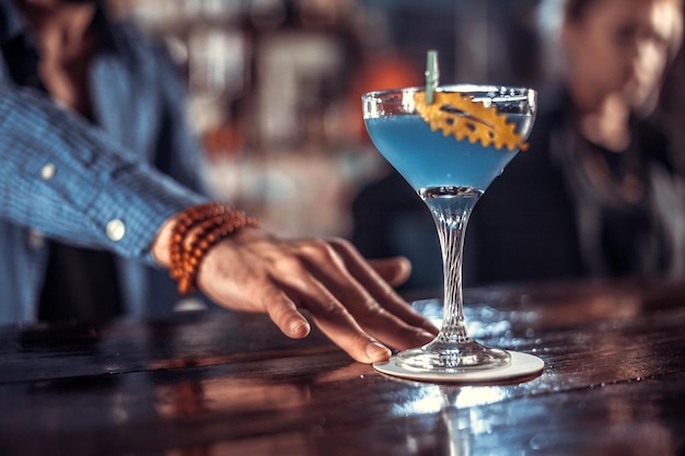 Bartender creates a cocktail in the alehouse