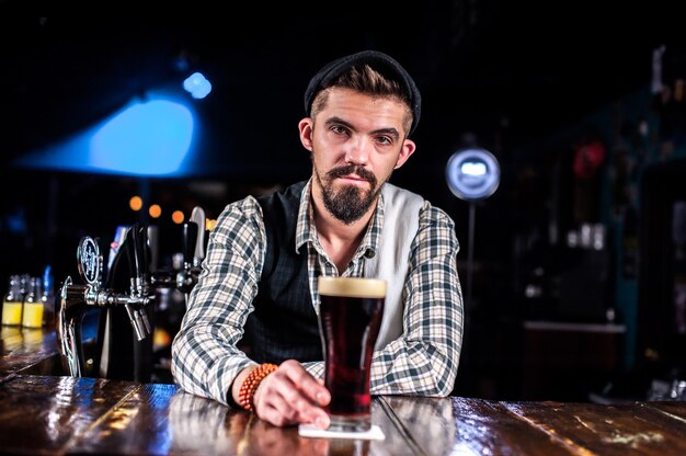 Bartender creates a cocktail in the public house