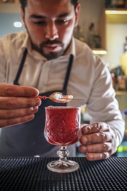 Bartender creates cocktail