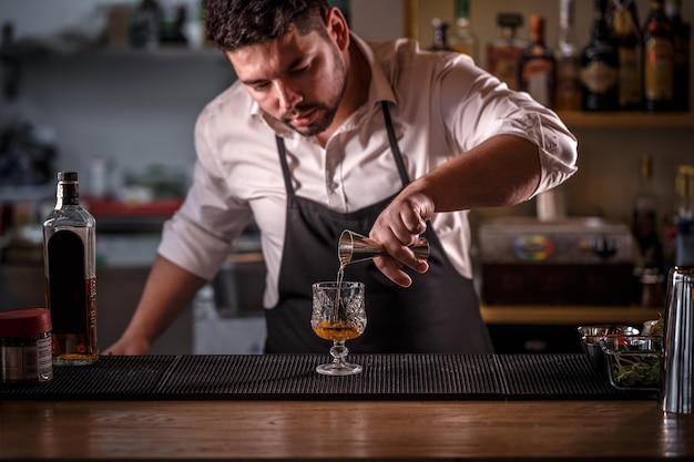 Bartender is pouring alcohol