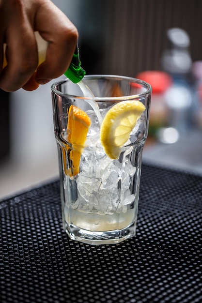 Bartender is pouring soda water