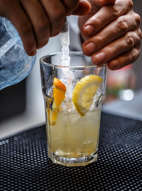 Bartender is pouring soda water