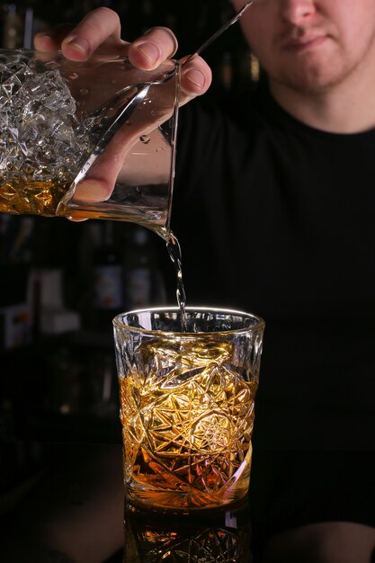 Bartender is prepairing cocktail drink