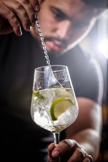 Bartender is stirring cocktail