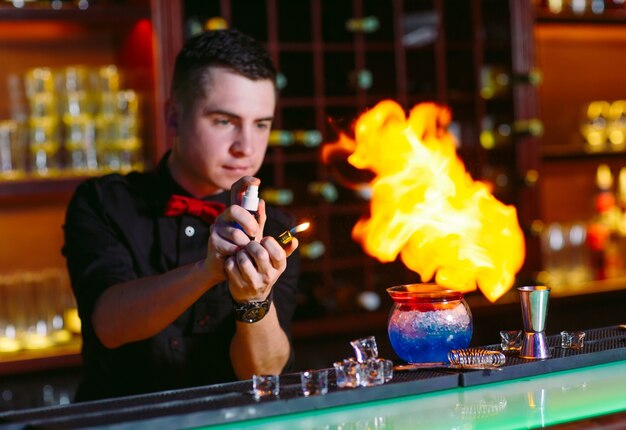 Bartender makes hot cocktail.