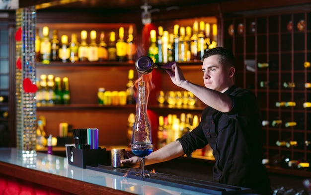 Bartender makes hot cocktail.