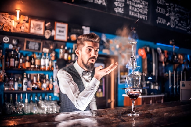 Bartender mixes a cocktail on the beerhall