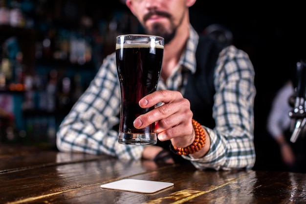 Bartender mixes a cocktail in the public house