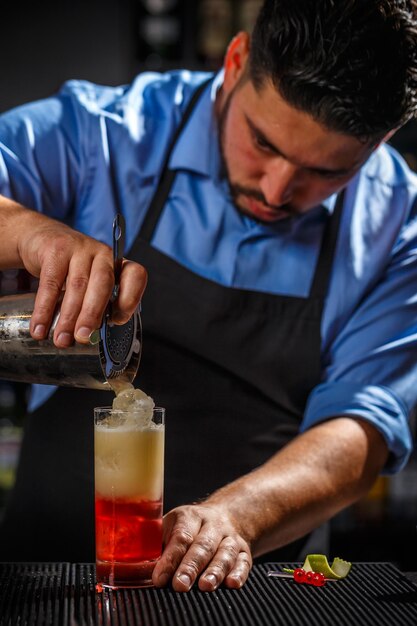 Bartender pouring cocktail