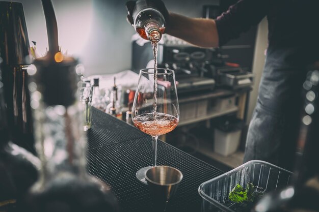 Bartender pouring wine