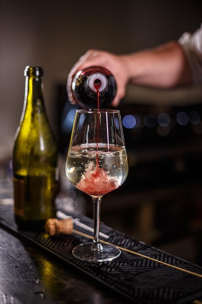 Bartender prepares an alcoholic cocktail