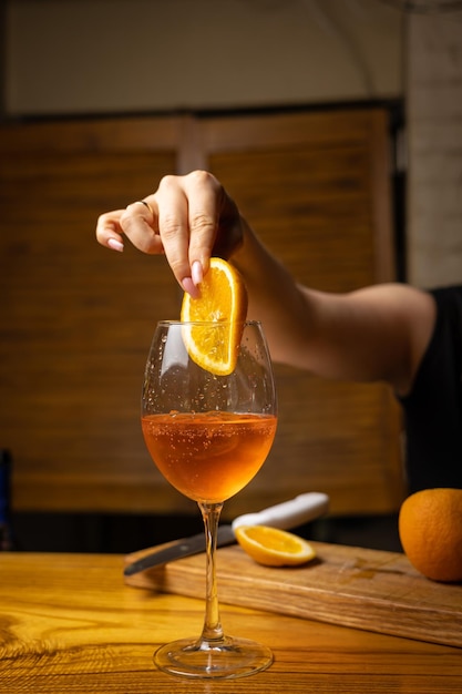 A bartender prepares a cocktail at the restaurant bar