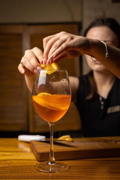 A bartender prepares a cocktail at the restaurant bar