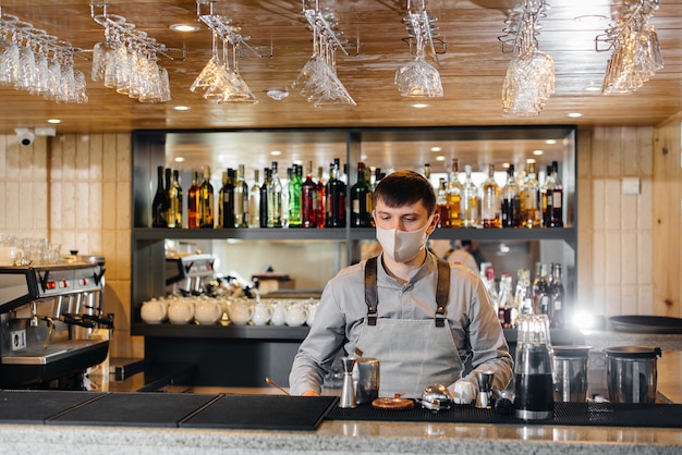 The bartender prepares cocktails in a modern restaurant.