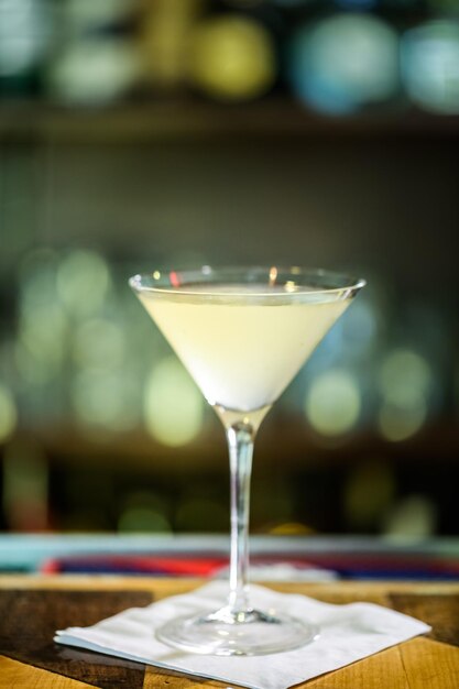 Bartender preparing Limoncello martini coctail.