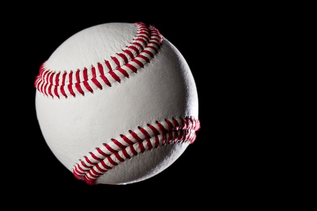 Baseball Ball closeup on a black wall