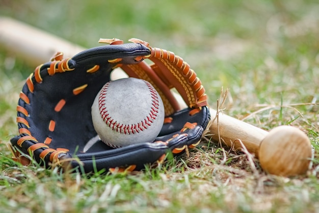 A baseball bat concept with ball outdoors in the park on the field