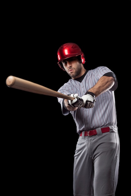 Baseball Player on a black background. Studio Shot.