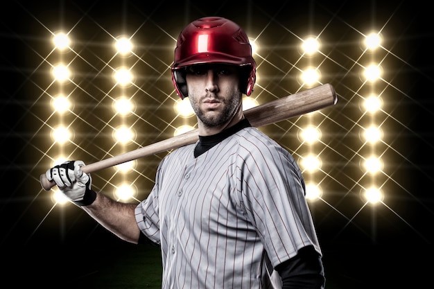 Baseball Player in front of lights.