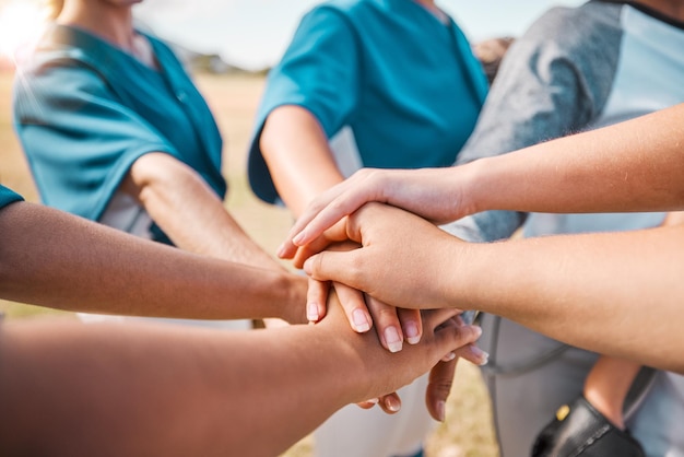 Baseball player women hands for teamwork motivation and mission on sports field group of people community or athlete girl hand pile for game or competition with outdoor sunshine lens flare