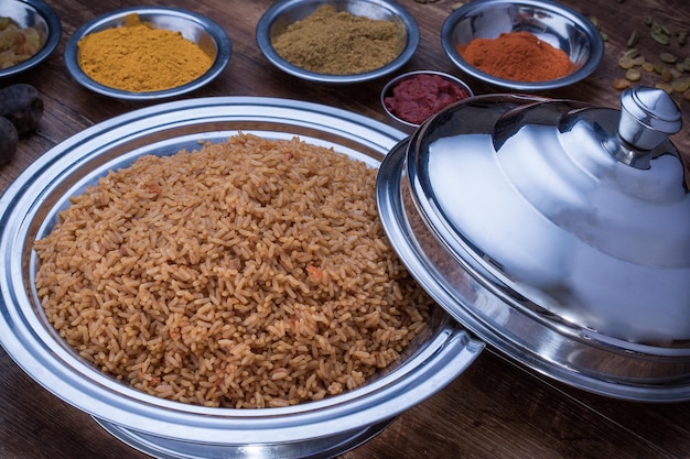 Bashawer Rice mandi biryani with fried onion served in dish isolated on table top view of arabic food