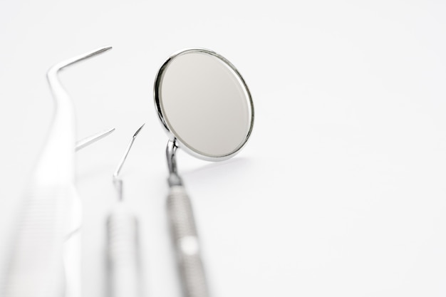 Photo basic dentist tools on white background.