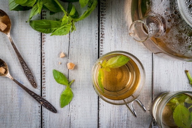 Basil herbal tea on wooden table