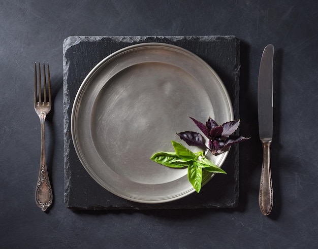 Basil leaves on an old plate