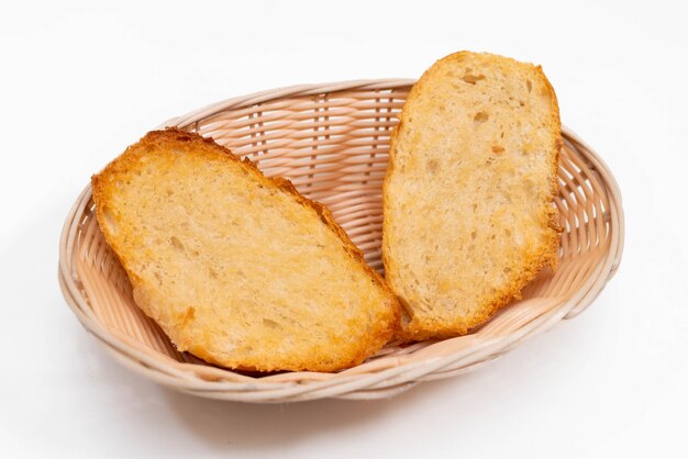 A basket of breads with a white background