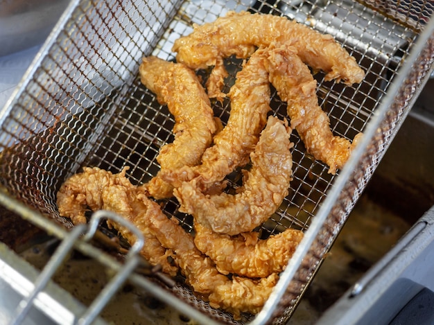 Basket of chicken nuggets removed from the fryer