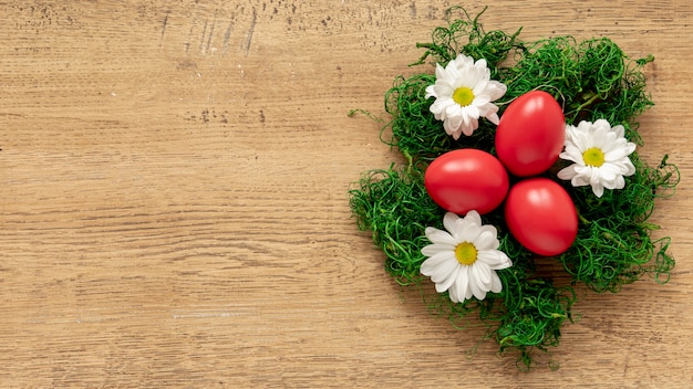 Photo basket decorated with flowers with eggs inside