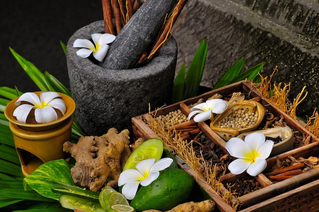 a basket of flowers and a pot of honey with a flower on it