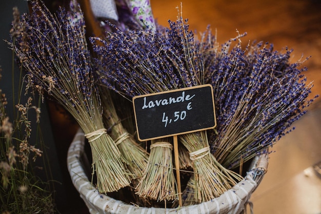 A basket of lavender is labeled with the word lavender on it.