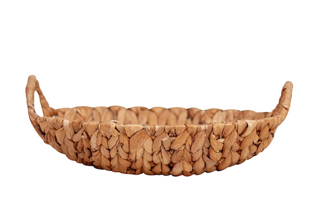 Basket made of wicker straw isolated on white background