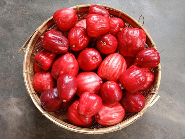 A basket of Malay apple or Jambu bol Syzygium malaccense also known as Malay rose apple