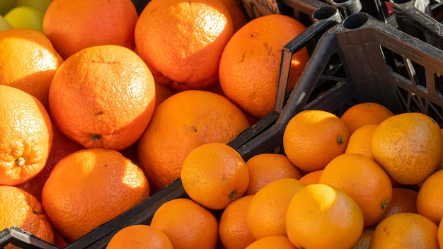 A basket of oranges next to each other with one that says oranges