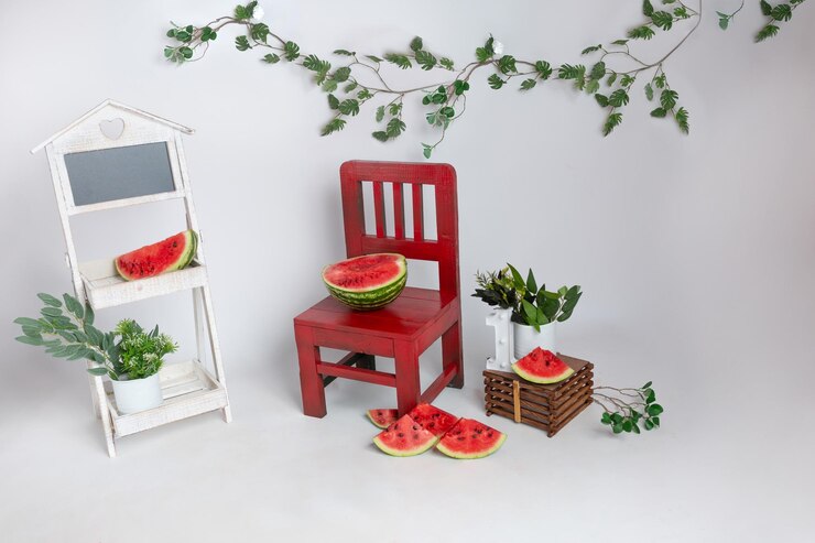 the basket for the photo shoot is decorated with watermelons basket for newborn photo sessions