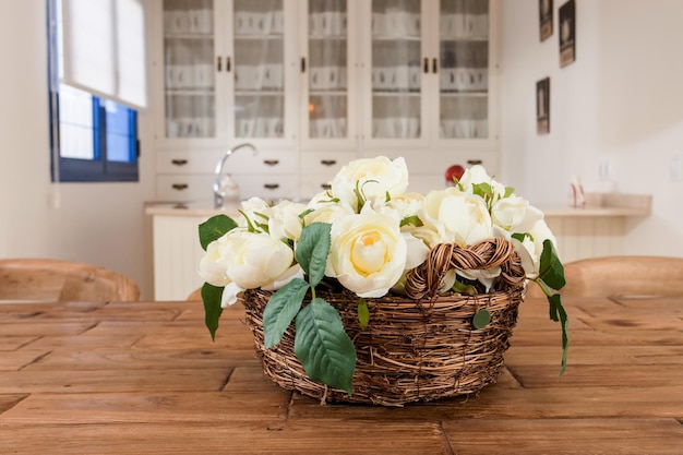basket of pretty flowers with kitchen in the background