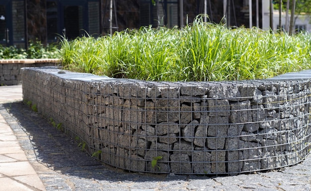 Basket support wall made of granite gabion Gabions in the garden Modern Gabion fence with stones